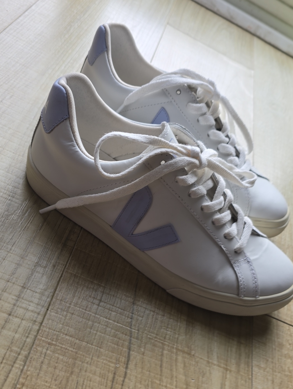 White Veja Leather Sneakers with Baby Blue Accents. Made In Brazil.